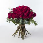 A bouquet of long-stem red roses.